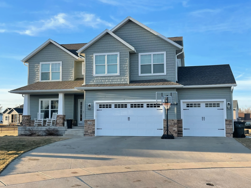 Finished fiber cement siding replacement enhancing a home in Cedar Rapids, Iowa